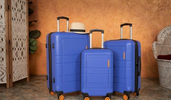 three pieces of blue luggage sitting next to each other